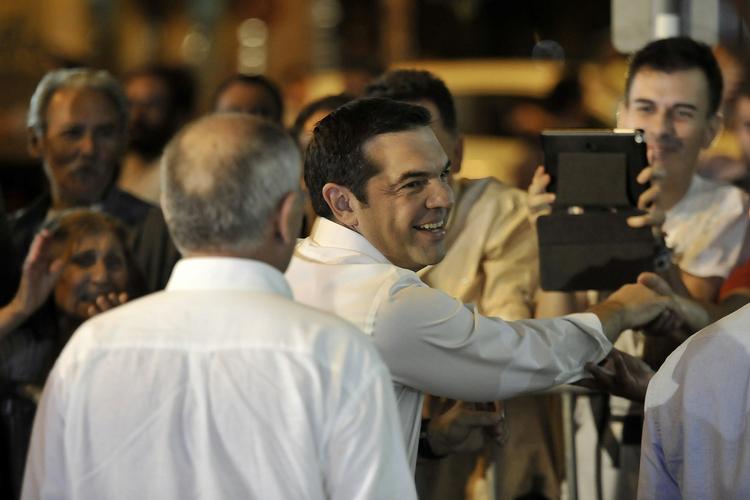 Vinder. Alexis Tsipras, leder af Syriza, advarer på valgaftenen også sine landsmænd om, at det bliver en hård omgang. 