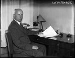 Politiker. Erik Scavenius fotograferet ved sit skrivebord omkring 1930. Han var udenrigsminister i flere omgange og statsminister fra 9. november 1942 til 29. august 1943 (formelt 5. maj 1945). 