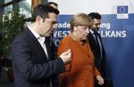 Topmøde. Den tyske kansler, Angela Merkel, siger på vej ind til minitopmødet, at hun søger »praktiske løsninger«. 