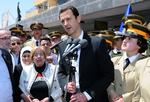 Borgerkrig. Syriens præsident Bashar Assad taler på en skole i Damaskus i maj. Støtte fra Rusland har indtil videre hjulpet ham med at beholde magten. 