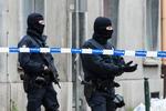 Aktion. Belgisk politi i forstaden Molenbeek. 