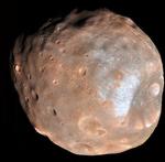 UNDERGANG. Når Phobos går i stykker, vil store dele af dens materiale ende med at danne en ring rundt om Mars. 