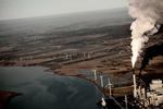 Klimapolitik. 'Grøn realisme' er mantraet for klimaminister Lars Chr. Lilleholt, som afviser nye initiativer i klimapolitikken ud over den udbygning med vindkraft, som allerede er fatalt. Her er det vindmøller ved Nordjyllandsværket i Aalborg. 