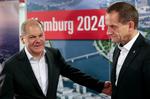 Tabt. Ansigtsudtrykkene hos borgmester Olaf Scholz (tv) og formanden for den tyske olympiske komité, Alfons Hörmann, fortalte det hele. 
