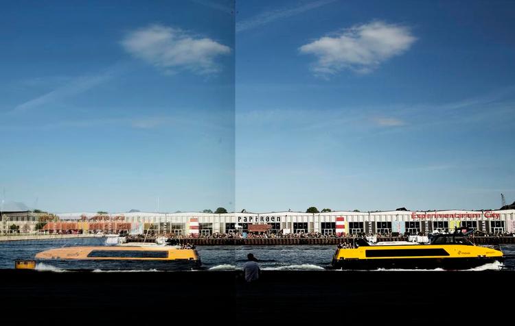 Efterstræbt. Papirøens gamle haller spejler sig i Skuespilhusets glasfacade. Når Eksperimentarium forlader sit midlidertidige lejemål hallerne til foråret, vil fonden Copenhagen Contemporary, en af de centrale bejlere til en fremtid på øen, rykke ind med et stort pilotprojekt. 