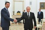 Venner. Putin har meddelt Syriens præsident, Bashar al-Assad, sin plan om tilbagetrækningen fra det krigshærgede Syrien. 