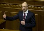 Afsked. Ukraines premierminister taler i parlamentet i Kiev. Sømdag meddeler han, at han vil træde tilbage. Arkivfoto. 