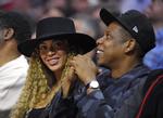 musikpar. Beyoncé med sin mand, Jay Z, til basketball i Los Angeles tidligere på året. Han får enden på komedie på Beyoncés nyudgivelse. 