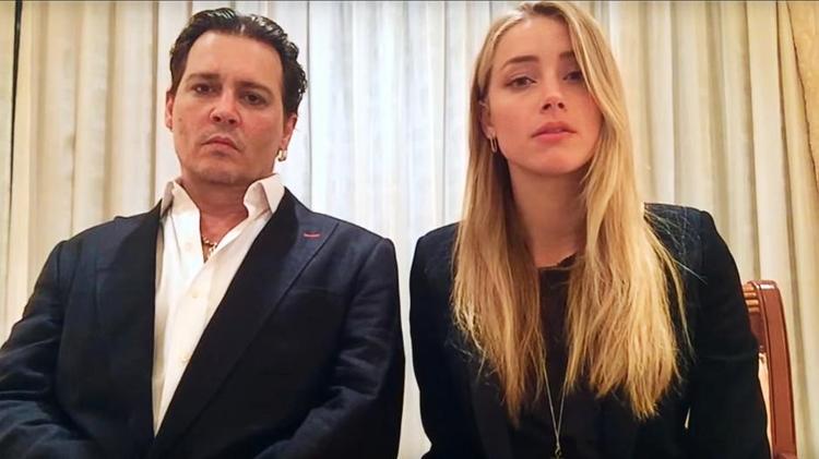 Undskyld. Johnny Depp og Amber Hearst lægger ikke meget entusiasme i undskyldningen, der skal fremme forståelsen for Australiens særlige plante- og dyreliv. -Foto: framegrab 