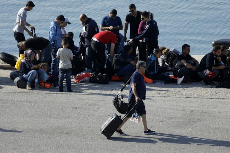 Greece Migrants And Tourists