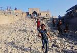 ØDELÆGGELSER. Indbyggere i Iraks næststørste by, Mosul, går på murbrokkerne af profeten Jonas' Moské, som er en af de mange kulturskatte, der er bevet sprængt i luften af Islamisk Stat. Senest er det gået ud over et tempel for den babyloniske visdoms- og skrivergud Nabu. Foto (arkiv): AP 