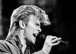 Ifølge Peter Hince, som har været roadie for både Queen og David Bowie, inviterede Queens trommeslager, Roger Taylor, David Bowie over, mens Queen var i Schweiz nær Bowies bolig.  