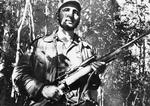 Fidel Castro, Cubas nu afdøde præsident fra 1959 til 2008, stod i spidsen for landets kommunistiske revolution. Her ses han i 1957 under oprørskampen. (Foto: AP) 