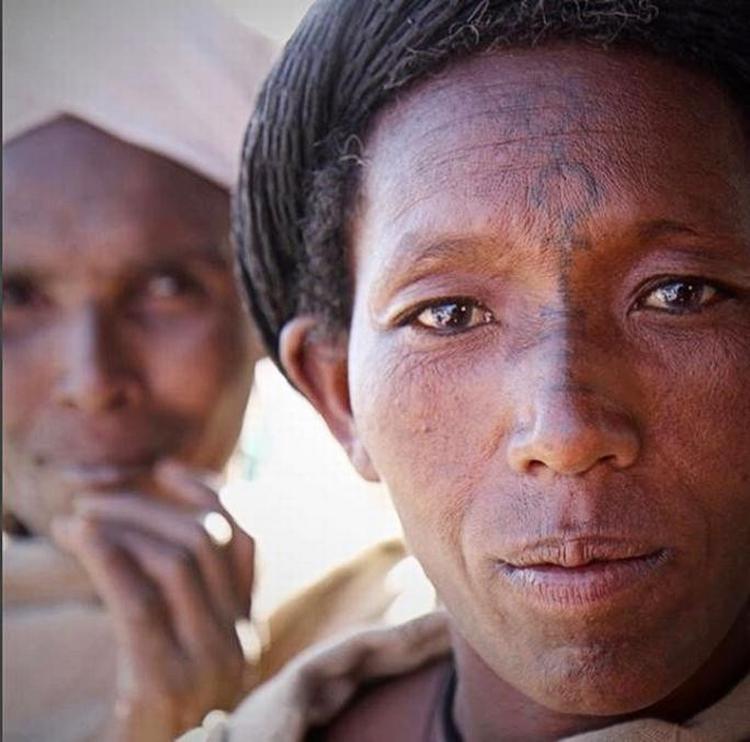 Pilgrim fra Lalibela, Etiopien med Venus-symbol tatovereti ansigtet. 