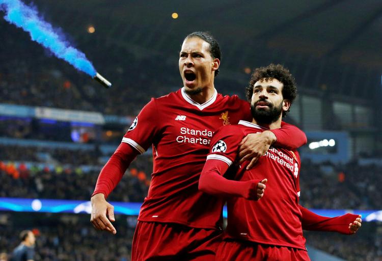  Virgil Van Dijk (tv.) og topscorer Mohamed Salah, der er tidligere Roma-spiller, skal en tur til Rom for at løse billet til Kijev.  Foto: Andrew Yates/Ritzau Scanpix. /Ritzau Scanpix